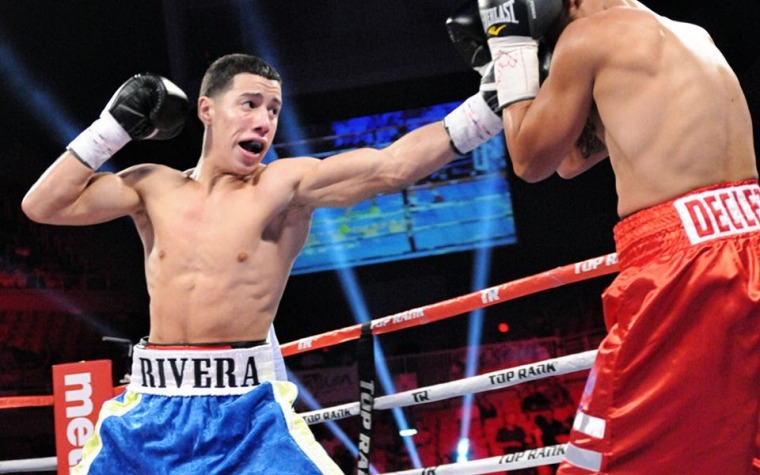 Invicto prospecto boricua firma con Top Rank